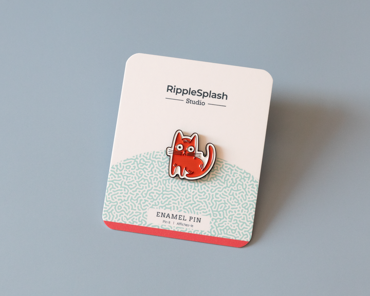 red cat enamel pin on branded backing card