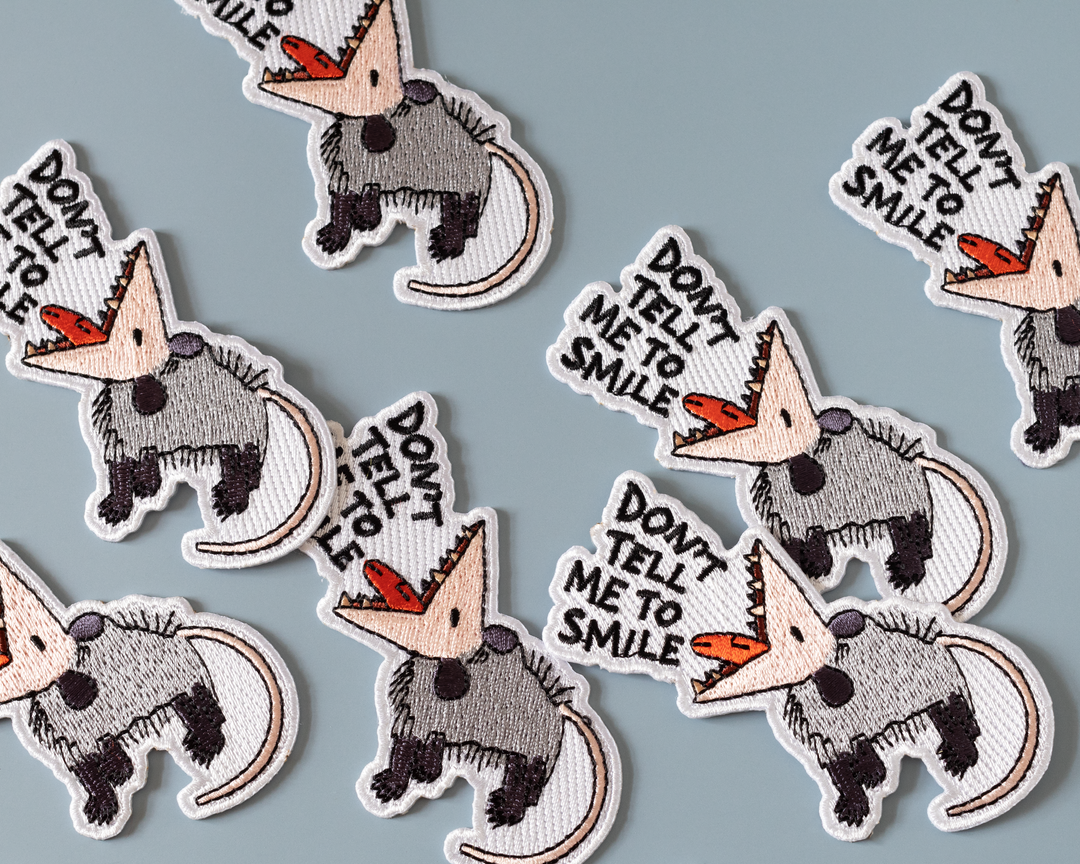 Don't Tell Me to Smile Possum Iron-On Patch